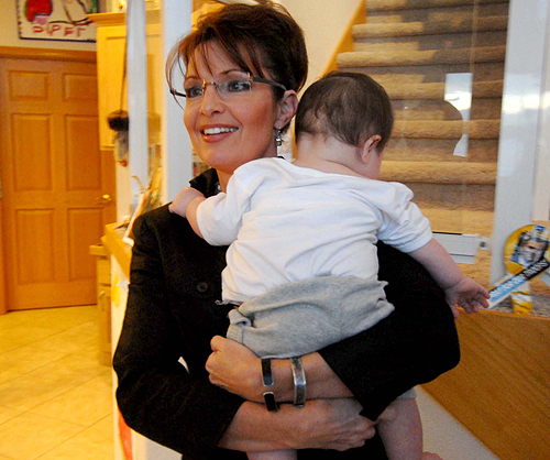 Alaska Gov. Sarah Palin holds her infant son Trig between interviews with local and national media at her home in Wasilla, Alaska, on Sunday, November 9, 2008. JOEY RICHARDSON / MCT 